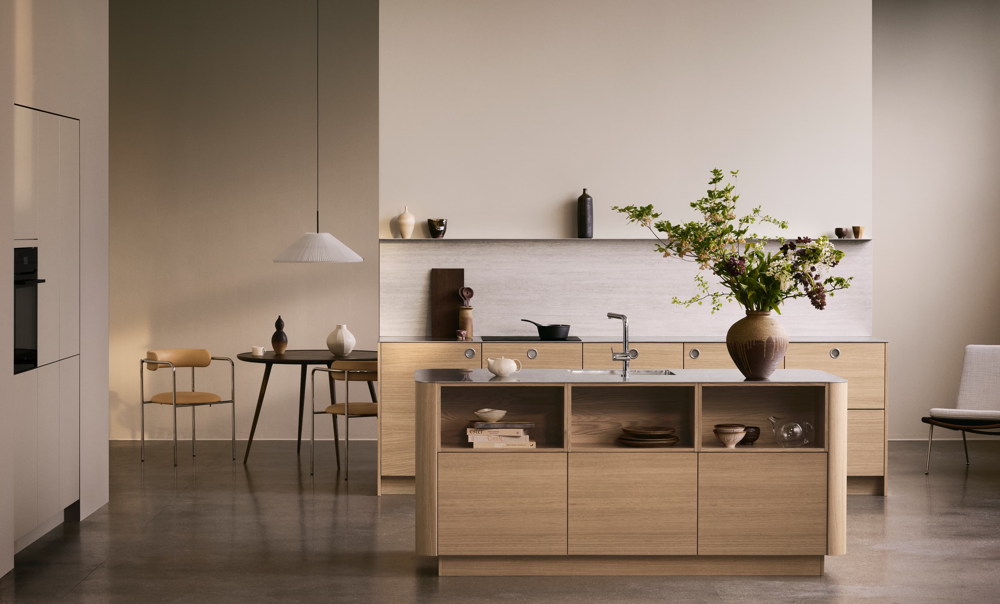 VEDA light oak kitchen with a minimalist design featuring sleek cabinetry, natural wood textures, and modern fixtures for a warm elegant space.